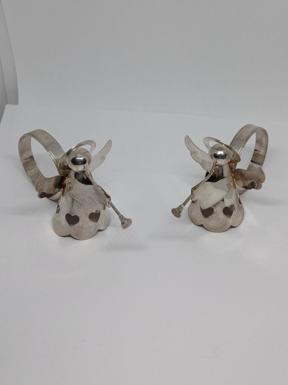 TWO VINTAGE SILVER PLATED ANGEL PLAYING TRUMPET NAPKIN RINGS Made in HONG KONG